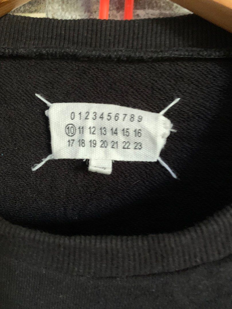 Maison Margiela Paris Sweatshirt (Category: Luxury Apparel) located in Cagayan de Oro. Submitted by densho69 (Listing ID 1416376526, Image 2). Description: Dimes: 22 x 27 (48 on tag, fit L) Color: 9/10 Condition: 9/10 Issue: Need wash.