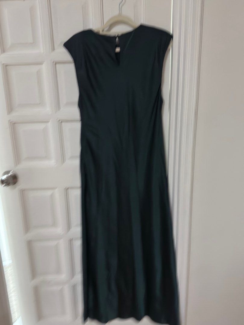 Mango Green Maxi Satin Dress (Category: Dresses) located in Mandaluyong City. Submitted by lucia93 (Listing ID 1416316715, Image 2). Description: - Mango green maxi dress - Size: L - Features: Cap sleeves, keyhole back - Design: Flowing silhouette - Condition: New with original tags - Perfect for special occasions - With flaw (see last photo).
