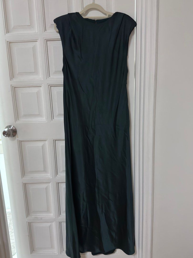Mango Green Maxi Satin Dress (Category: Dresses) located in Mandaluyong City. Submitted by lucia93 (Listing ID 1416316715, Image 1). Description: - Mango green maxi dress - Size: L - Features: Cap sleeves, keyhole back - Design: Flowing silhouette - Condition: New with original tags - Perfect for special occasions - With flaw (see last photo).