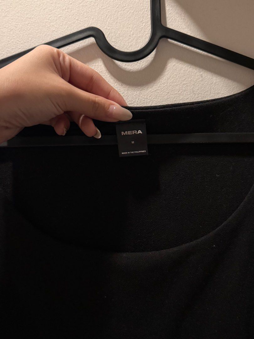 Mera Black Scoop Neck Top (Category: Shirts) located in Pasig City. Submitted by lovedstuff2020 (Listing ID 1416409394, Image 2). Description: Black scoop neck top from Mera. It has short sleeves and a fitted silhouette. The top is made in the Philippines. The size is M..