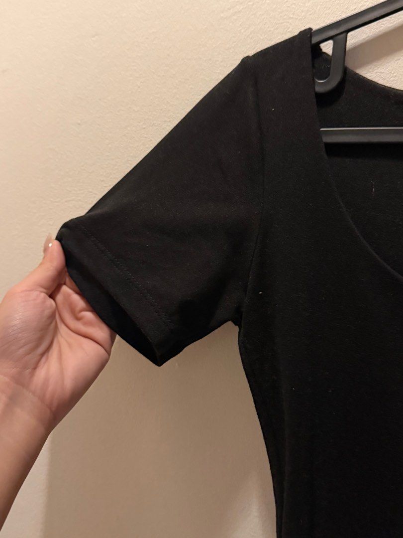 Mera Black Scoop Neck Top (Category: Shirts) located in Pasig City. Submitted by lovedstuff2020 (Listing ID 1416409394, Image 3). Description: Black scoop neck top from Mera. It has short sleeves and a fitted silhouette. The top is made in the Philippines. The size is M..