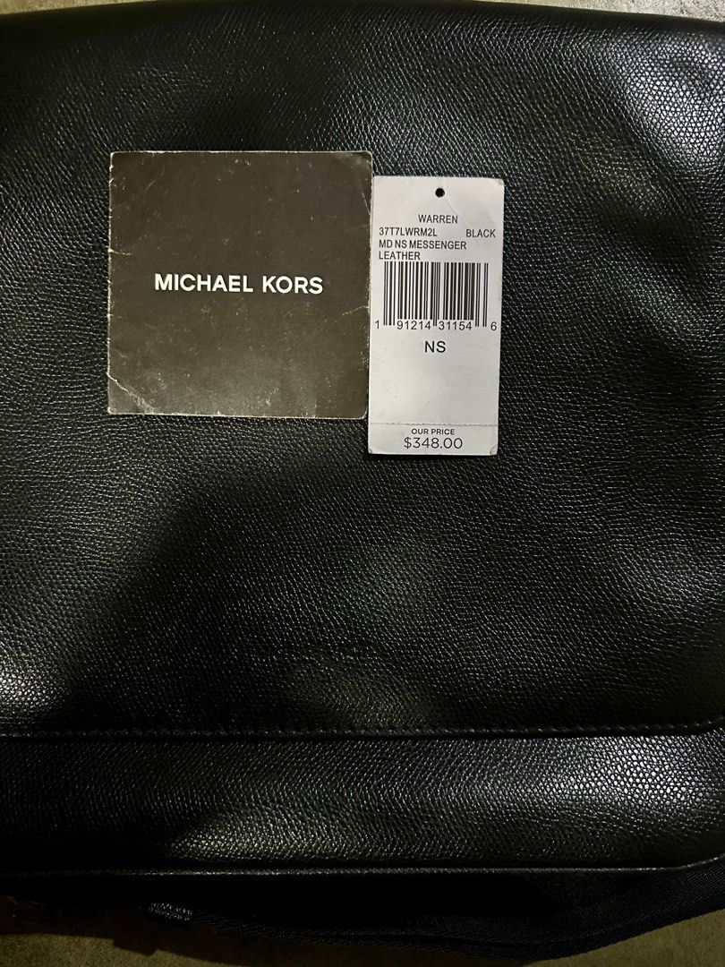 Michael Kors Warren Messenger Bag - Black (Category: Luxury Bags & Wallets) located in Candaba. Submitted by shokgold19 (Listing ID 1416428593, Image 2). Description: - Authentic Michael Kors Warren messenger bag - Color: Black - Features: - Flap closure - Adjustable shoulder strap - Multiple interior compartments - Material: Textured leather - Michael Kors logo on lining - Includes original tags.