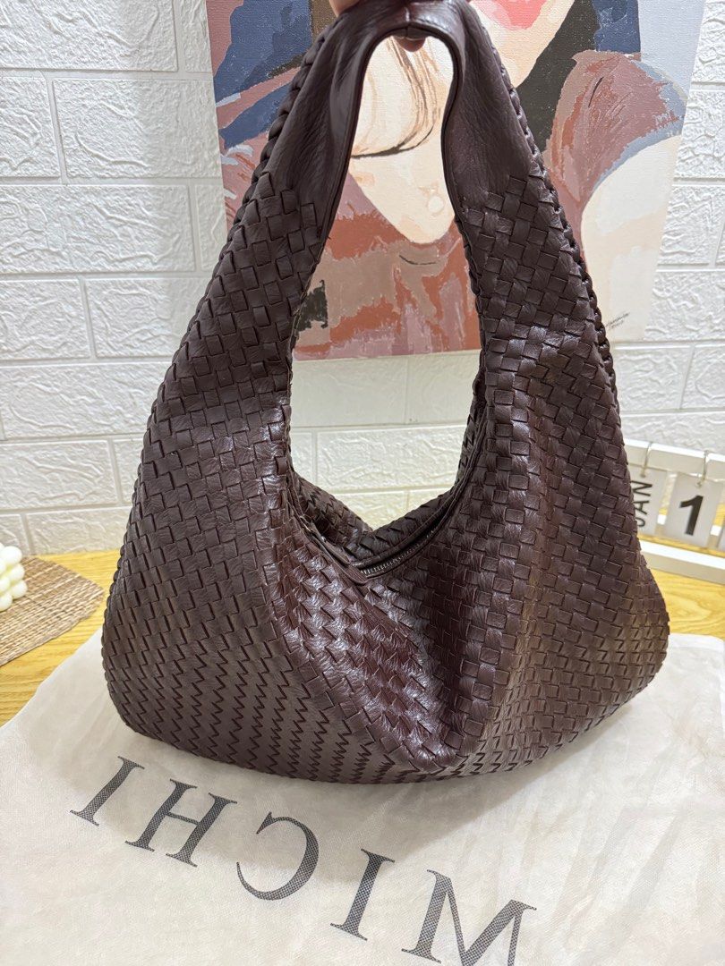 MICHI Woven Shoulder Bag (Category: Shoulder Bags) located in Castillejos. Submitted by jmb_preloved (Listing ID 1416346780, Image 2). Description: Bough in Online App worth P1,049 - Makapal and not look cheap yung quality -Stylish woven shoulder bag - Rich brown color - Single shoulder strap - Includes dust bag - Spacious design - Brand: MICHI RFS: DECLUTTERING .