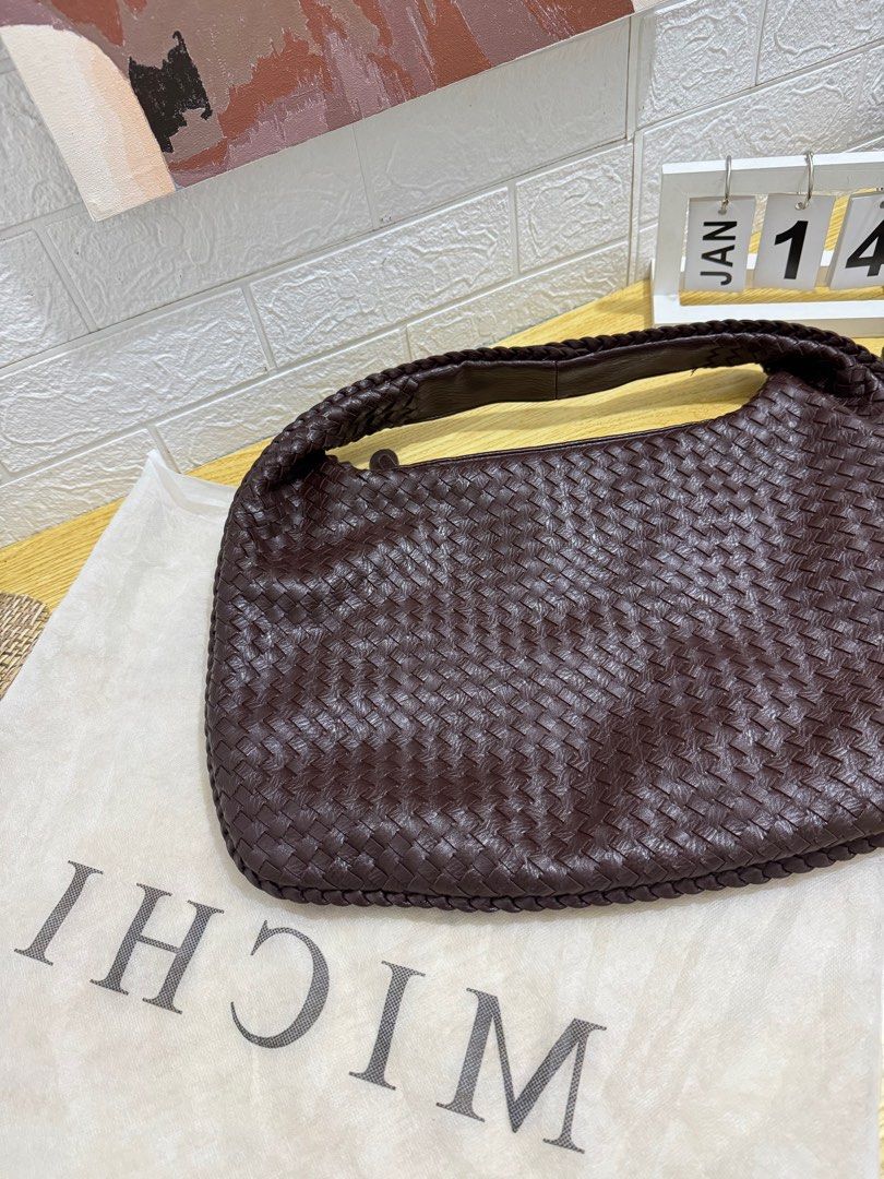 MICHI Woven Shoulder Bag (Category: Shoulder Bags) located in Castillejos. Submitted by jmb_preloved (Listing ID 1416346780, Image 1). Description: Bough in Online App worth P1,049 - Makapal and not look cheap yung quality -Stylish woven shoulder bag - Rich brown color - Single shoulder strap - Includes dust bag - Spacious design - Brand: MICHI RFS: DECLUTTERING .