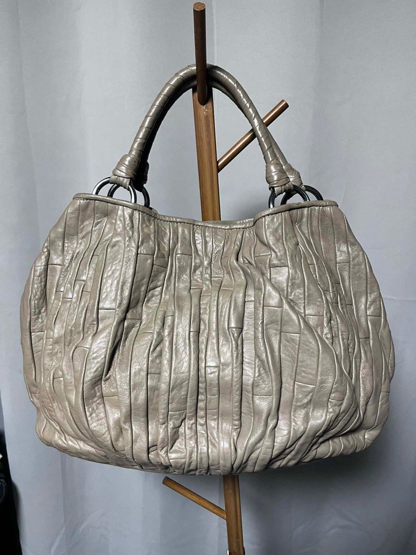 Miu Miu Matelasse Bag - Beige (Category: Luxury Bags & Wallets) located in Quezon City. Submitted by carmeladelacruz82 (Listing ID 1416407586, Image 1). Description: - AUTHENTIC Miu Miu Matelasse Tote Bag - Color: Beige - Material: Leather - bag only - Condition: no major flaws - Issue: bag has some scuffs on the handle (see last pictures).
