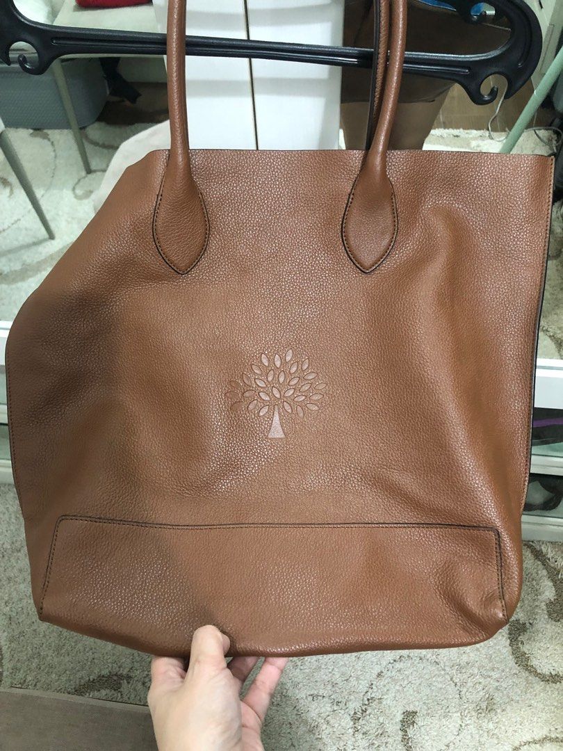 Mulberry Brown Leather Tote Bag (Category: Luxury Bags & Wallets) located in Caloocan City. Submitted by Aira90 (Listing ID 1416267626, Image 1). Description: - Mulberry brown leather tote bag - Spacious interior with an additional pocket - Features two top handles - Mulberry logo embossed on the front - Lined with a lighter-colored material - Crafted from high-quality leather Retail Price is around 30,000 up price is negotiable.