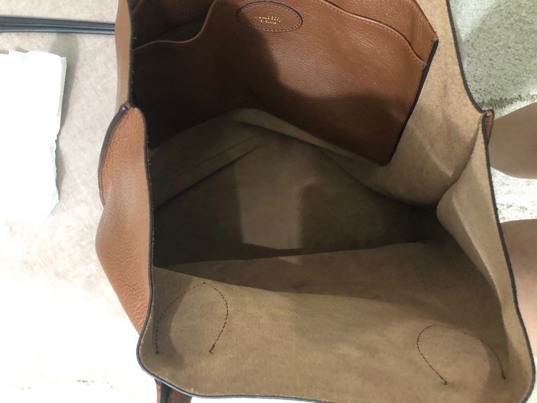 Mulberry Brown Leather Tote Bag (Category: Luxury Bags & Wallets) located in Caloocan City. Submitted by Aira90 (Listing ID 1416267626, Image 2). Description: - Mulberry brown leather tote bag - Spacious interior with an additional pocket - Features two top handles - Mulberry logo embossed on the front - Lined with a lighter-colored material - Crafted from high-quality leather Retail Price is around 30,000 up price is negotiable.
