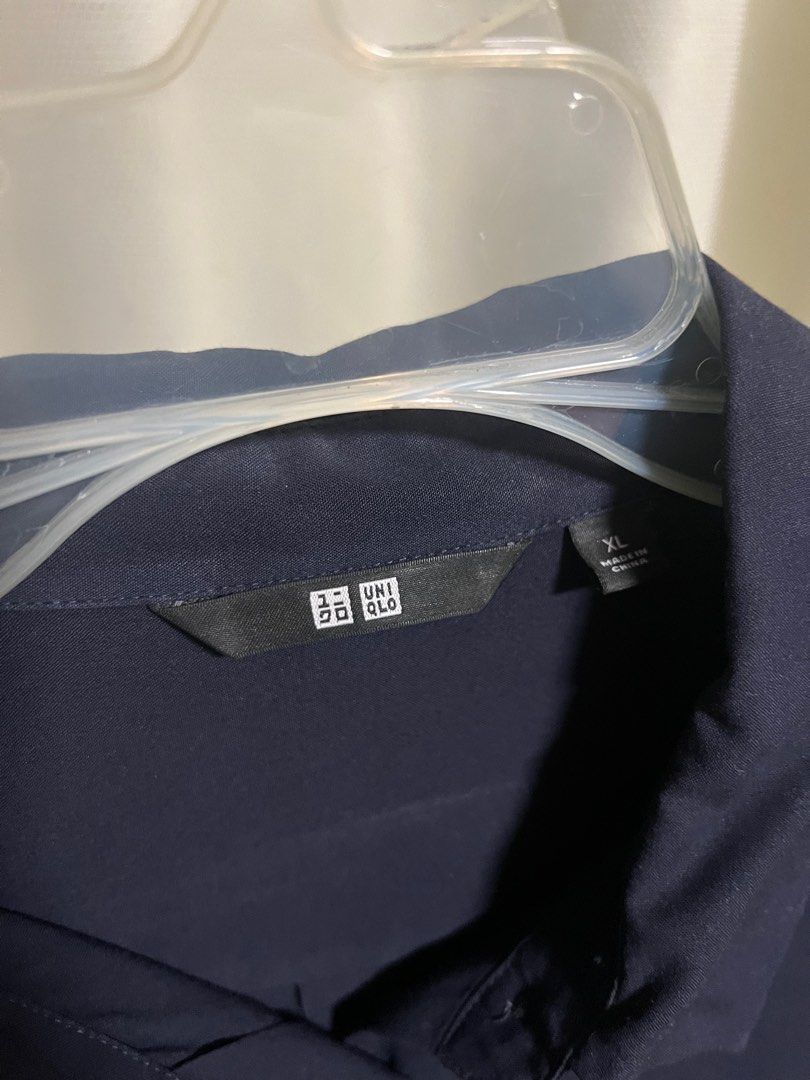 Navy Blue Button-Down (Category: Longsleeves) located in Makati City. Submitted by helpmedeclutter03 (Listing ID 1416275106, Image 3). Description: - Uniqlo size XL - Women’s - Used but no damage - Only issue is semi fading in neck/collar area - Complete buttons.