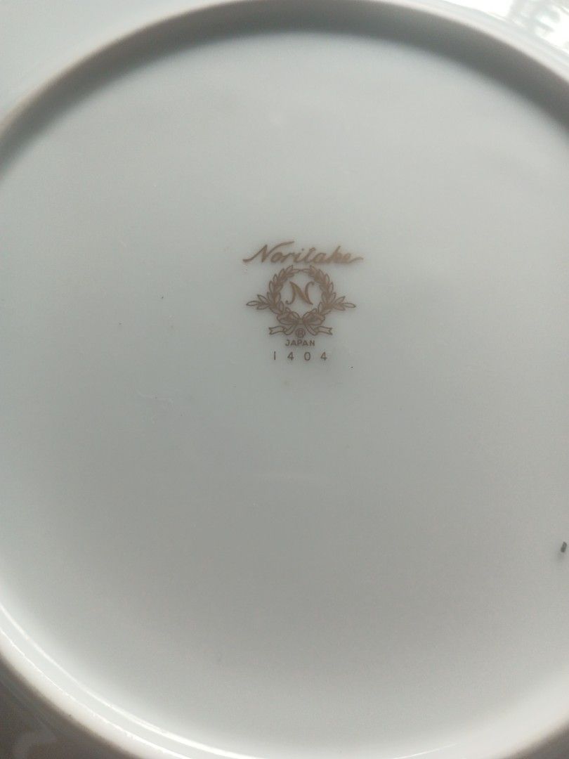 Noritake Dinner Plates Set of 4 (Category: Dinnerware & Cutlery) located in Manila. Submitted by christalyn94263 (Listing ID 1416431232, Image 2). Description: - Set of 4 Noritake dinner plates - Features a white base - Delicate floral design with gold rim - Marked with Noritake logo and "Japan 1404" - Adds elegance to your dining experience.
