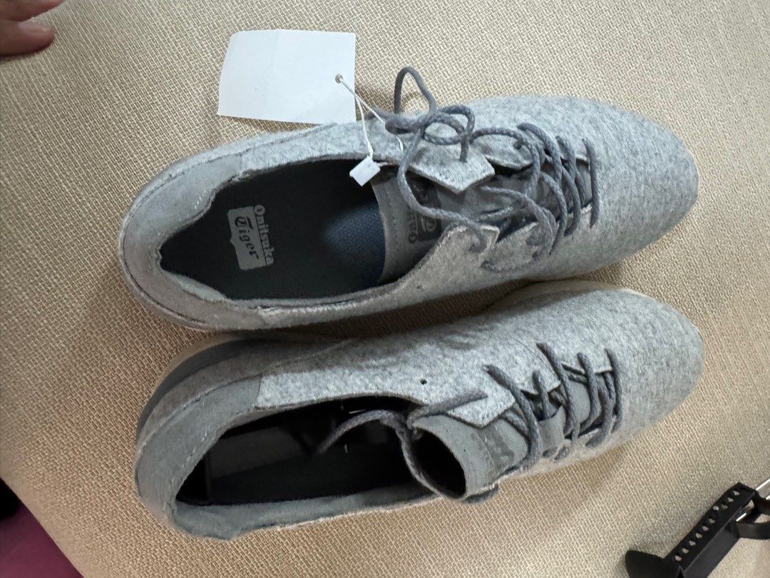 Onitsuka Tiger Sneakers (Category: Sneakers) located in Taguig. Submitted by declutterme12 (Listing ID 1416221786, Image 2). Description: - Onitsuka Tiger sneakers - Grey fabric upper - White sole - Lace-up closure - Brand logo on tongue and sole - Textured sole for grip.