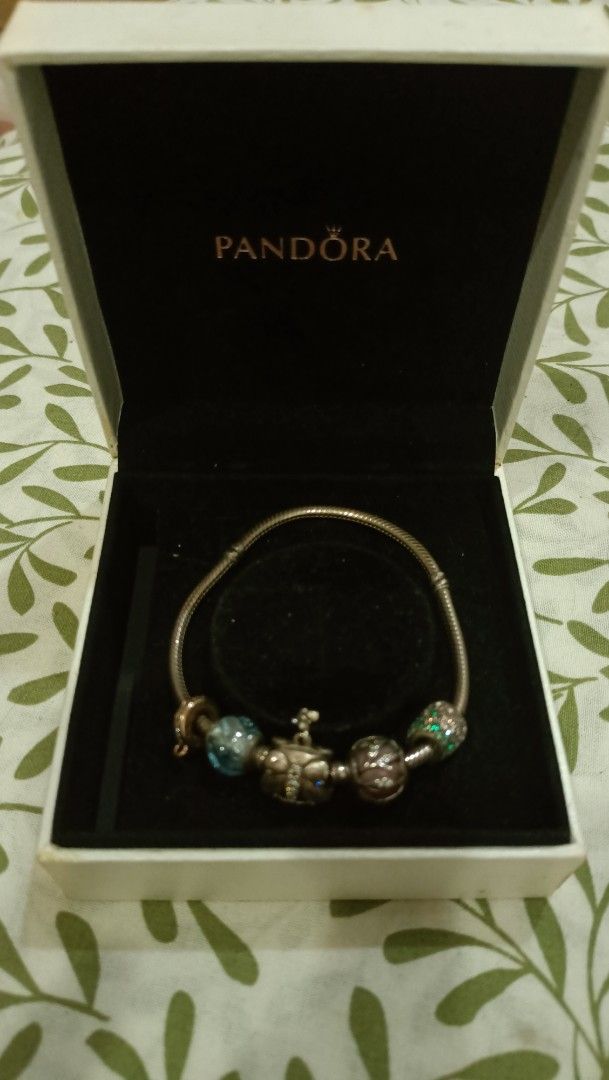 Pandora Bracelet with Charms (Category: Bracelets) located in Taguig. Submitted by lux_limited (Listing ID 1416423934, Image 3). Description: - Authentic Pandora bracelet - Includes butterfly, blue, pink, and green charms - Comes with original Pandora box - Made of silver - Elegant design.