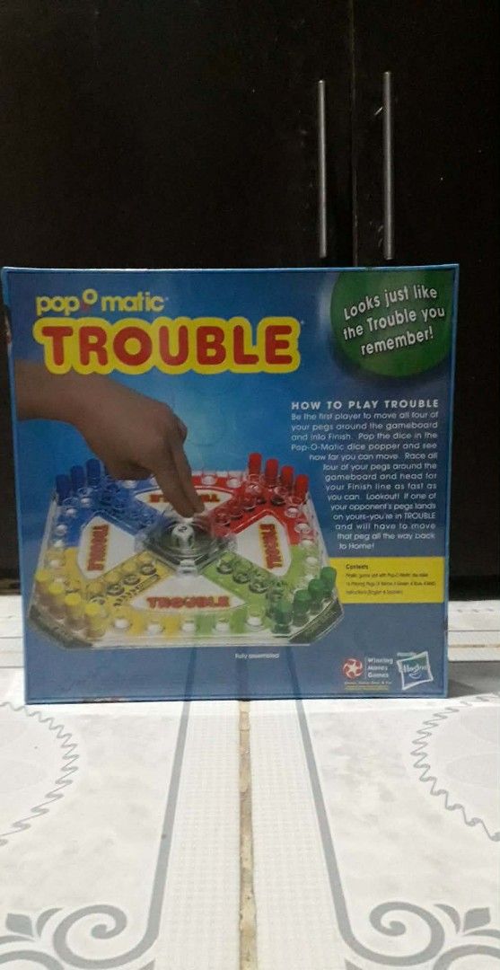 Pop-O-Matic Trouble Board Game (Category: Board Games & Puzzles) located in Binan City. Submitted by ollkorrect (Listing ID 1416382975, Image 2). Description: 🟢 Pop-o-matic Trouble Board Game - Classic race-ahead family game - Features the iconic Pop-o-matic dice roller - Ages 5+, 2–4 players - Brand new, sealed box 💵 Minimum Price: ₱1,200 Antipolo City #BoardGames #FamilyFun #ClassicToys #TroubleGame.