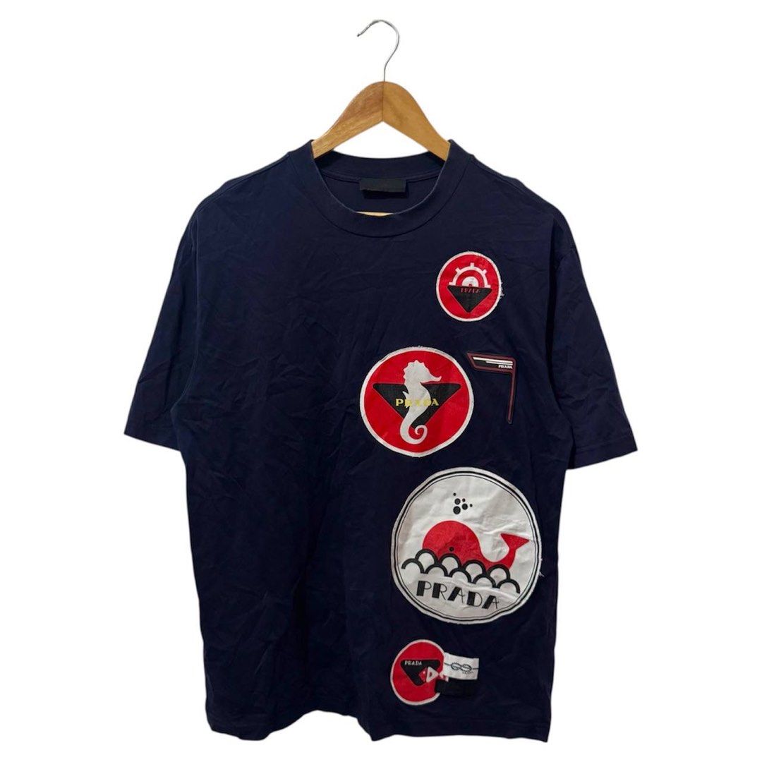 Prada Limited Edition Nautical T-shirt (Category: Luxury Apparel) located in Manila. Submitted by retro.archives (Listing ID 1416394276, Image 1). Description: Prada Limited Edition Nautical T-shirt 📌 Size: M ti L Dimes: 21"x28" Condition: 8.5/10 Issue: Mini Pinhole not visible 🧷 Price: 700 📍 Angeles City, Pampanga 🚛 Courier – J&T (Regular Shipping).