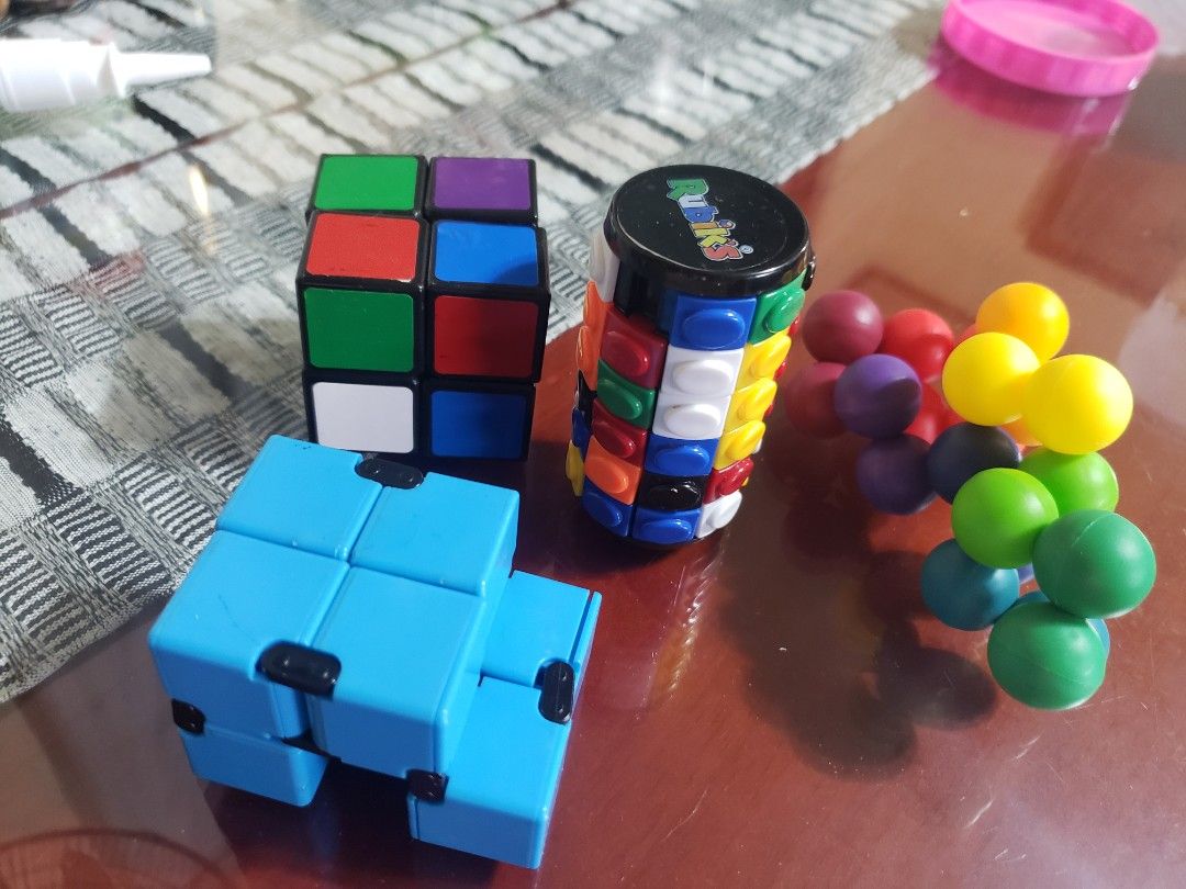 Puzzle Cube, Infinity Cube, and Magnetic Balls (Category: Board Games & Puzzles) located in Manila. Submitted by feg39 (Listing ID 1416255512, Image 1). Description: - Puzzle Cube: Multi-colored sides for a classic challenge. - Infinity Cube: Smooth blue design for endless fidgeting. - Magnetic Balls: Various colors for creative play and stress relief. - Great for: Stress relief and fun!.