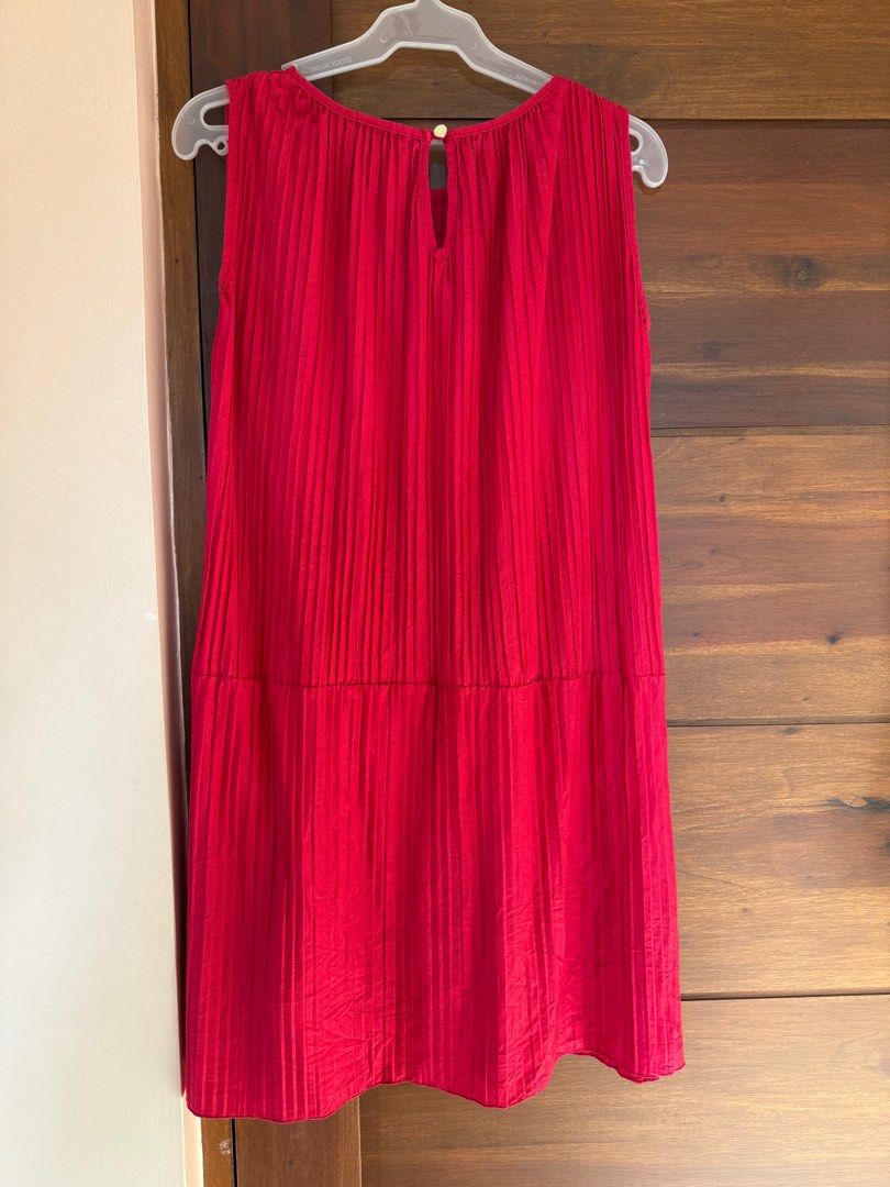 Red Pleated Sleeveless Dress (Category: Dresses) located in Antipolo. Submitted by reeanaaa_ (Listing ID 1416307189, Image 2). Description: - Sleeveless red dress - Pleated design - Round neckline with keyhole back - Lightweight fabric - Simple, elegant silhouette.