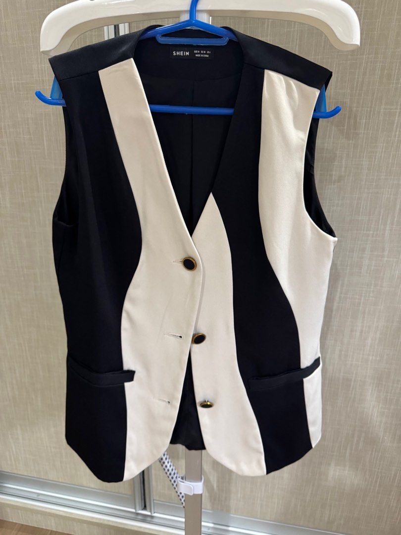 SHEIN Black and White Vest (Category: Sleeveless) located in Tarlac. Submitted by abromo (Listing ID 1416241117, Image 1). Description: - SHEIN vest - Black and white color block design - V-neckline - Three buttons - Two front pockets - Size: M (EU 38, US 6) - Made in China.