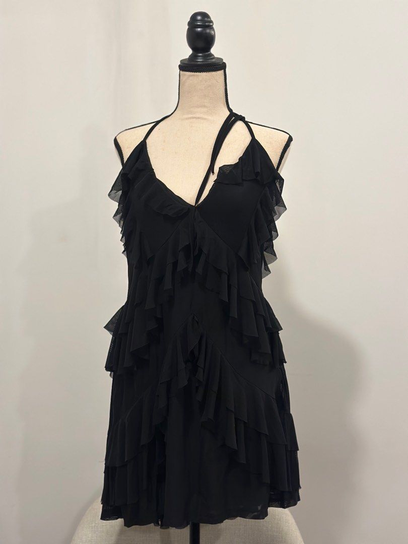 Shein Curve Halter Ruffle Dress (Category: Dresses) located in Makati City. Submitted by onthegridddd (Listing ID 1416348505, Image 1). Description: - Shein Curve black halter dress - Size: 1XL - Features: Tiered ruffle design, low back - Material: Polyamide and elastane blend - Perfect for: Night out, special occasion - USED ONCE.