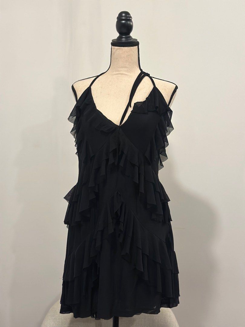 Shein Curve Halter Ruffle Dress (Category: Dresses) located in Makati City. Submitted by onthegridddd (Listing ID 1416348505, Image 2). Description: - Shein Curve black halter dress - Size: 1XL - Features: Tiered ruffle design, low back - Material: Polyamide and elastane blend - Perfect for: Night out, special occasion - USED ONCE.