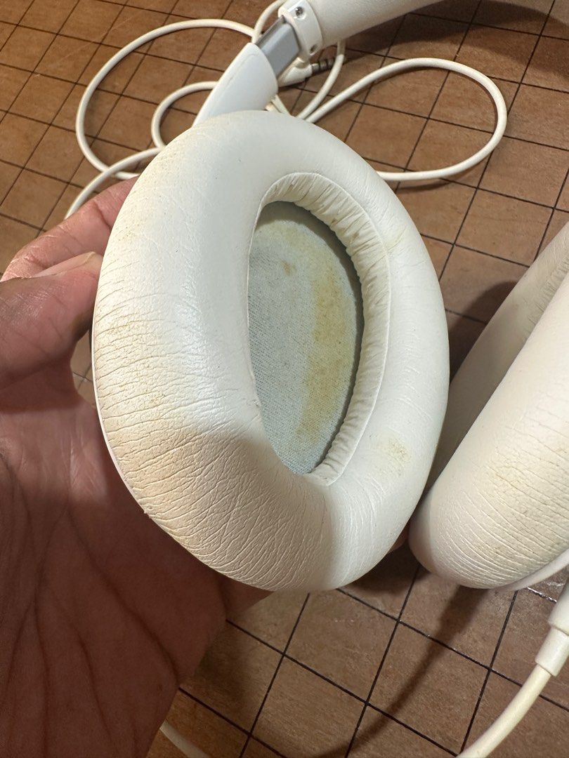 Sony MDR-10R Headphones (Category: Headphones & Headsets) located in Rodriguez. Submitted by pwestoonlinestore (Listing ID 1416346305, Image 2). Description: - White Sony MDR-10R headphones - Wired connection - White earcups and headband - Visible wear and discoloration on earcups - Model number visible - Made in Malaysia.