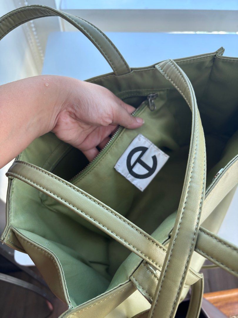Telfar Shopping Bag - Medium (Category: Luxury Bags & Wallets) located in Taguig. Submitted by ij_dh (Listing ID 1416432020, Image 3). Description: Telfar Sage Green - orig price 14k-16k - ordered from site - w/ receipt - super well used/loved - rfs: replacing my work bag .