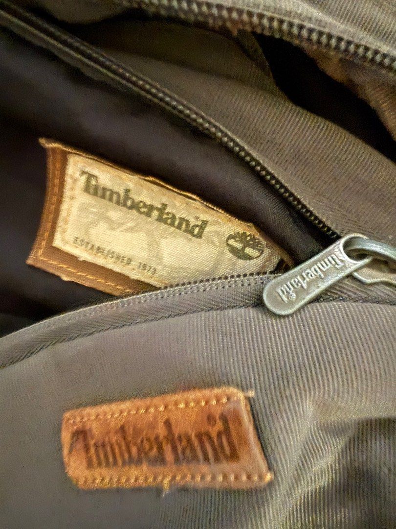 Timberland Backpack (Category: Backpacks) located in Calamba. Submitted by mokissm226349 (Listing ID 1416302294, Image 3). Description: - GreenTimberland backpack - Brown leather accents - Main compartment with zipper closure - Front pocket with mesh design - Top handle - Timberland logo on front and inside - Small zippered pocket With laptop sleeve (10-11 inches) One zipper not working.