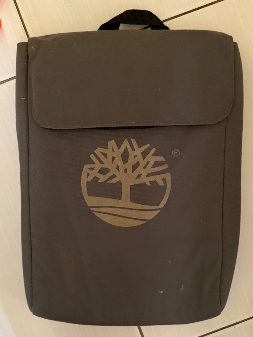 Timberland Backpack (Category: Backpacks) located in Calamba. Submitted by mokissm226349 (Listing ID 1416302294, Image 2). Description: - GreenTimberland backpack - Brown leather accents - Main compartment with zipper closure - Front pocket with mesh design - Top handle - Timberland logo on front and inside - Small zippered pocket With laptop sleeve (10-11 inches) One zipper not working.