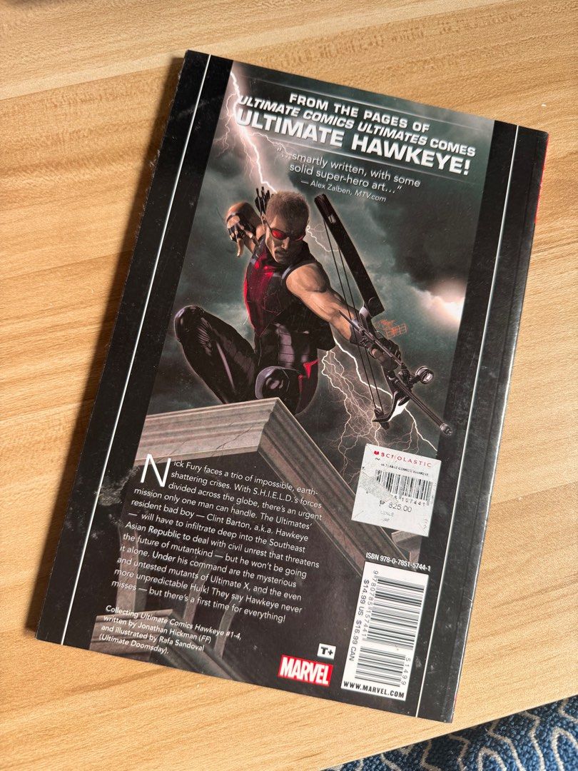 Ultimate Comics Hawkeye (Category: Comics & Manga) located in Manila. Submitted by godallan672142 (Listing ID 1416256374, Image 2). Description: - Ultimate Comics Hawkeye graphic novel - Published by Marvel - Features Hawkeye on the cover - Includes a story description on the back - Contains colorful illustrations.