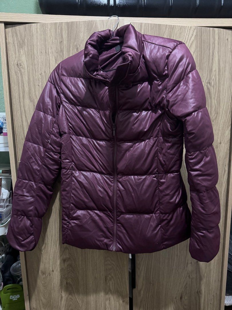 Uniqlo Puffer Jacket - Burgundy (Category: Coats, Jackets and Outerwear) located in Rizal. Submitted by igarette (Listing ID 1416428104, Image 1). Description: - Uniqlo Puffer Jacket - Rich burgundy color - Size: Small - Full zipper closure - High collar - Material: Polyester and Down - Comes with detachable hoodie.