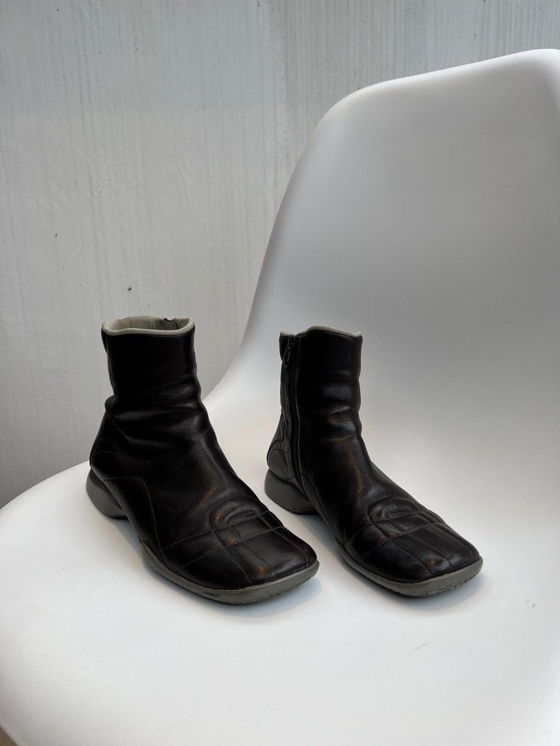 Vintage 90s Prada Leather Boots (Category: Boots) located in Binan City. Submitted by ninibuyshere (Listing ID 1416216416, Image 3). Description: RFS: Declutterring Price is negotiable Size 35 on tag but fits 36 - Vintage leather Prada boots - Square toe design - Side zippers - Padded collar - Gray sole with red accent - Prada logo visible inside - Soles show wear - Check photos to see minor flaws - No Box.