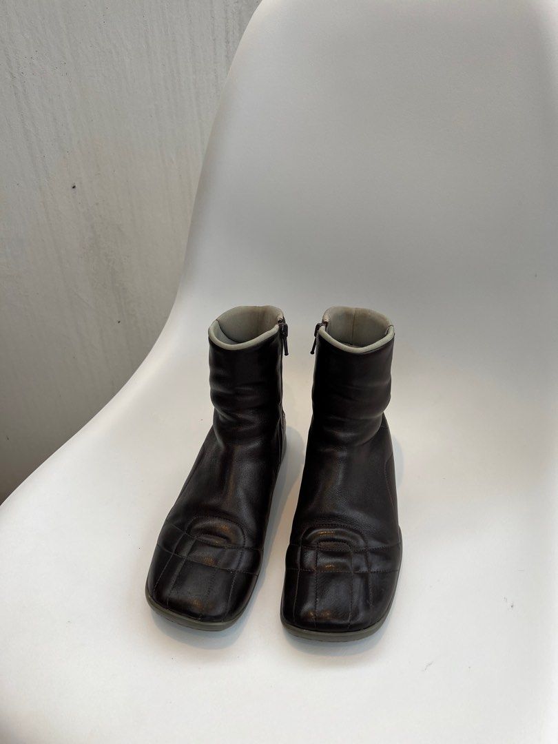 Vintage 90s Prada Leather Boots (Category: Boots) located in Binan City. Submitted by ninibuyshere (Listing ID 1416216416, Image 1). Description: RFS: Declutterring Price is negotiable Size 35 on tag but fits 36 - Vintage leather Prada boots - Square toe design - Side zippers - Padded collar - Gray sole with red accent - Prada logo visible inside - Soles show wear - Check photos to see minor flaws - No Box.