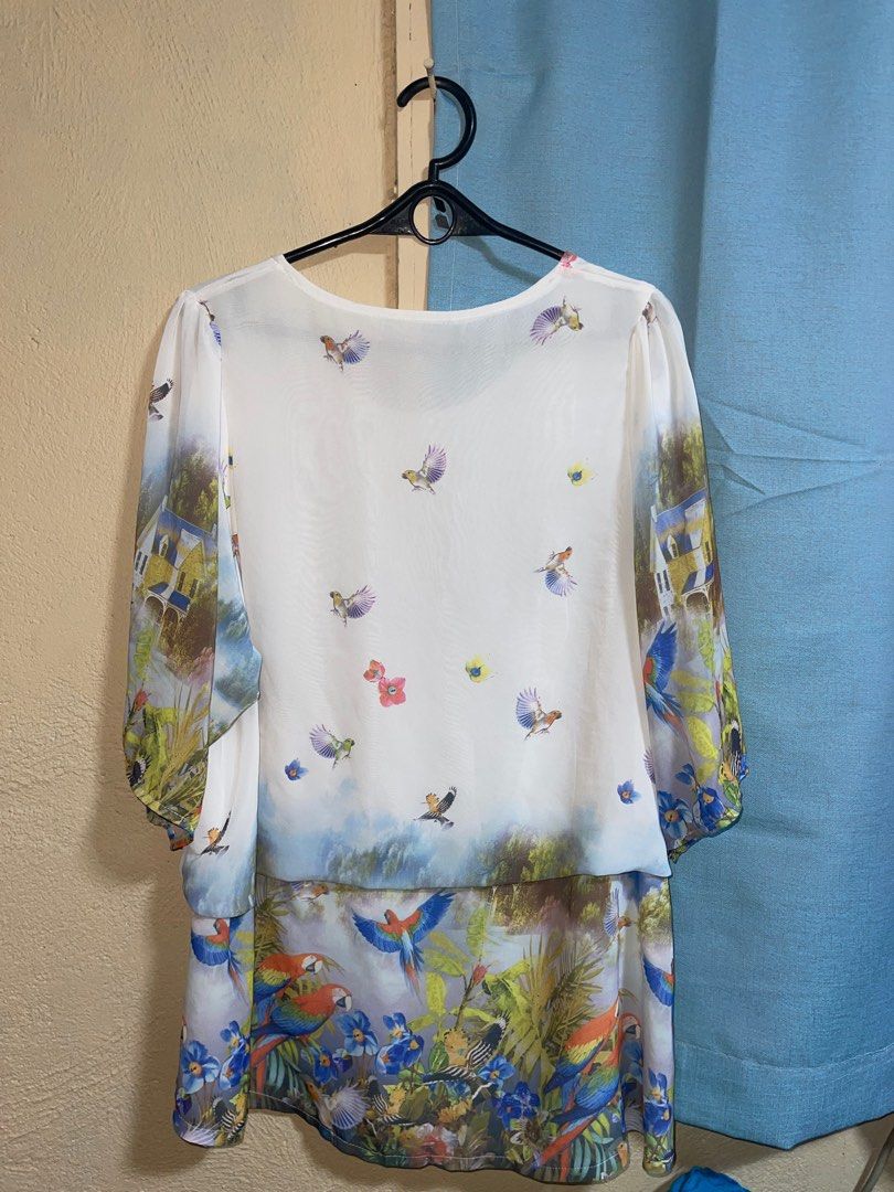 Vintage Printed Blouse with Bird Design (Category: Blouses) located in Quezon City. Submitted by ___maris03 (Listing ID 1416402125, Image 2). Description: - Unique bird print design - Round neckline - Three-quarter sleeves - Button detail on the side - Lightweight fabric - Ideal for warm weather.
