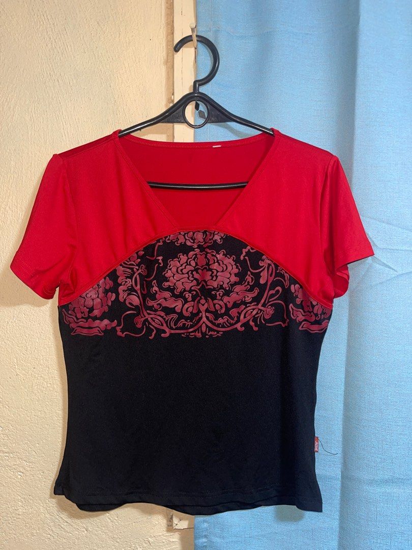 y2k Red and Black V-Neck Top (Category: Blouses) located in Quezon City. Submitted by ___maris03 (Listing ID 1416401440, Image 1). Description: - Color block design (red and black) - Decorative floral pattern on the front - V-neck - Short sleeves - Color-blocked back - Everyday wear.