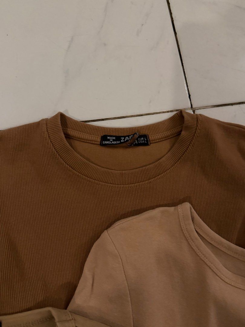 Zara Tops Bundle (Category: Blouses) located in Pasig City. Submitted by lovedstuff2020 (Listing ID 1416410168, Image 3). Description: - Zara brown tops bundle. - Includes: ribbed top, puff sleeve top, cropped top. - Sizes: S-M - Perfect for casual outfits..
