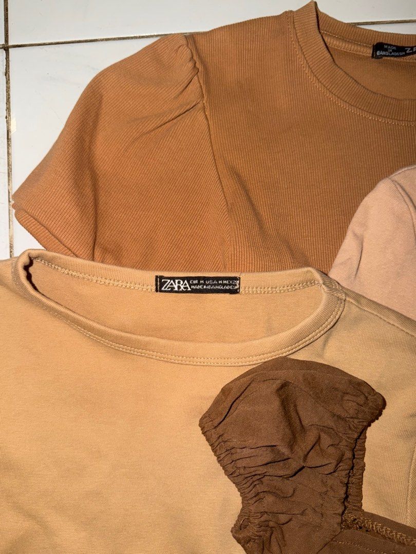 Zara Tops Bundle (Category: Blouses) located in Pasig City. Submitted by lovedstuff2020 (Listing ID 1416410168, Image 2). Description: - Zara brown tops bundle. - Includes: ribbed top, puff sleeve top, cropped top. - Sizes: S-M - Perfect for casual outfits..