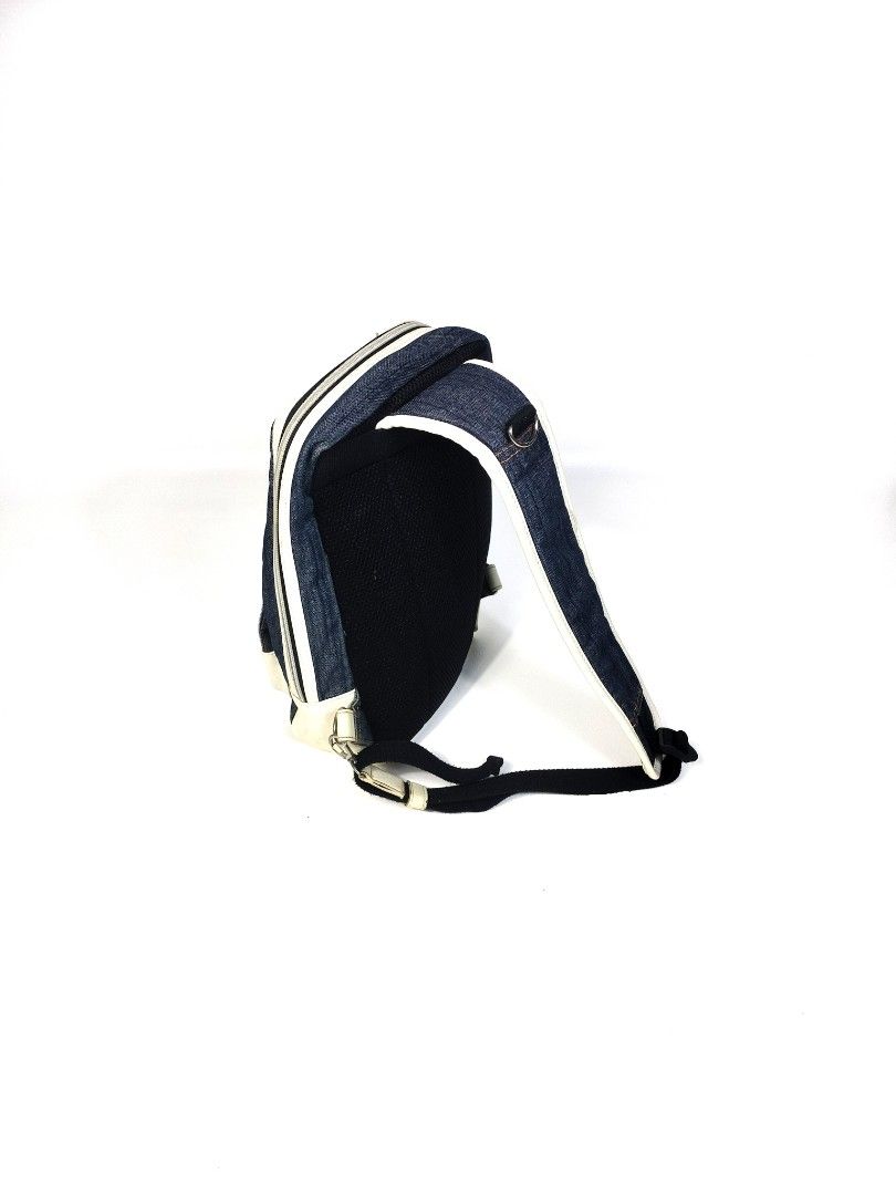 Alpha Industries Denim Leather BodyBag (Category: Backpacks) located in Manila. Submitted by callmetin (Listing ID 1416564056, Image 3). Description: Alpha Industries backpack features a denim exterior with white accents. It has a front pocket and a main compartment with a zipper closure. The backpack includes adjustable shoulder straps and a top handle. The interior lining is a dark green color. The Alpha Industries logo is visible on the front.