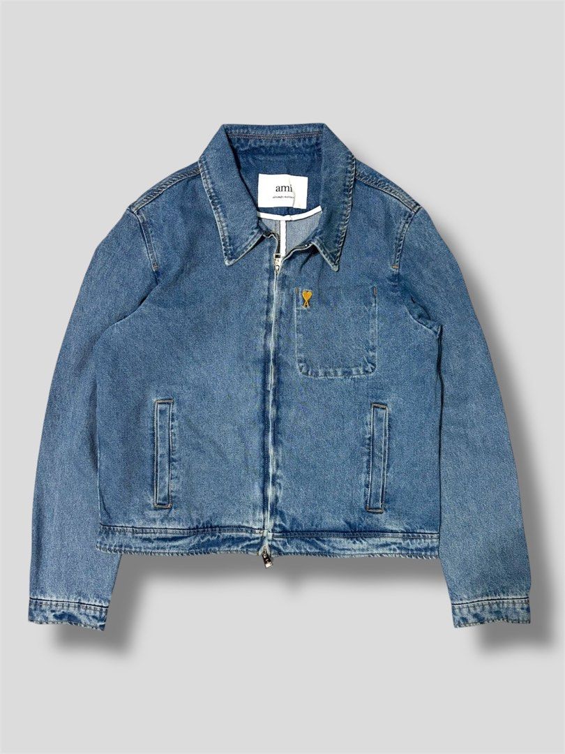 AMI Paris Denim Jacket (Category: Coats, Jackets and Outerwear) located in Antipolo. Submitted by gsauze (Listing ID 1416450234, Image 1). Description: - AMI Paris denim jacket - Size: L - Light blue wash - Classic design with zip closure - Features a small chest pocket - AMI logo on zipper and chest - Made in Portugal.