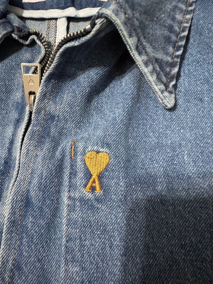 AMI Paris Denim Jacket (Category: Coats, Jackets and Outerwear) located in Antipolo. Submitted by gsauze (Listing ID 1416450234, Image 2). Description: - AMI Paris denim jacket - Size: L - Light blue wash - Classic design with zip closure - Features a small chest pocket - AMI logo on zipper and chest - Made in Portugal.