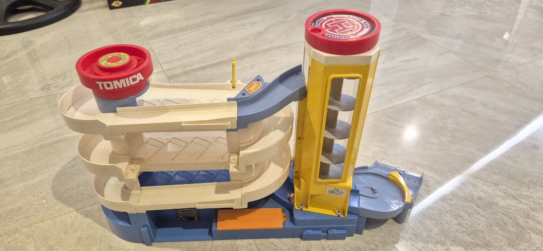 Authentic TOMICA super auto parking garage building (Category: Vehicle & Diecast Models) located in Taguig. Submitted by ipsagar (Listing ID 1416553087, Image 2). Description: - Authentic TOMICA - Multi-level parking - Spiral ramp for car descent WYSIWYG :) some parts may be missing. cars not included. no box .