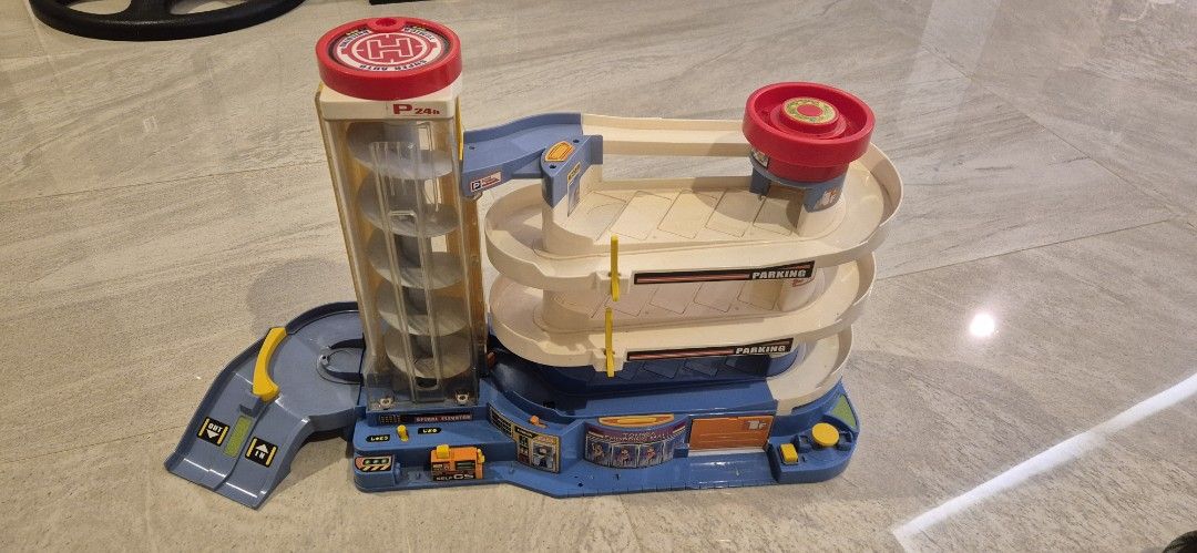 Authentic TOMICA super auto parking garage building (Category: Vehicle & Diecast Models) located in Taguig. Submitted by ipsagar (Listing ID 1416553087, Image 1). Description: - Authentic TOMICA - Multi-level parking - Spiral ramp for car descent WYSIWYG :) some parts may be missing. cars not included. no box .