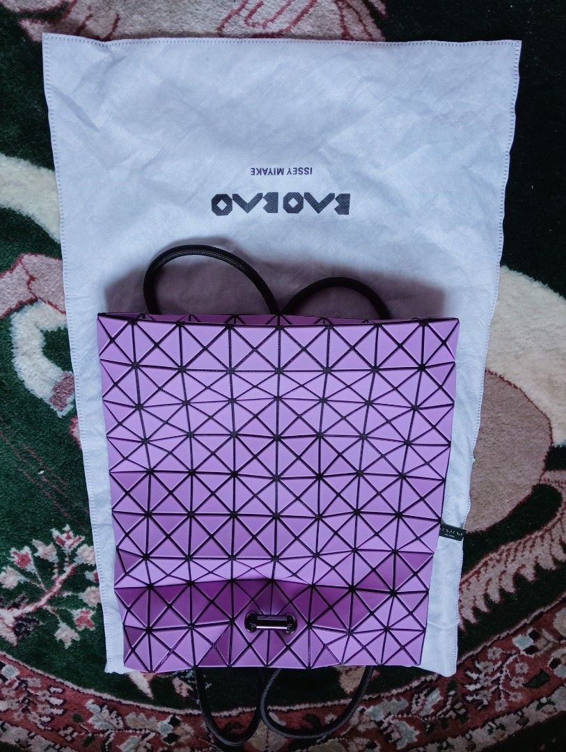 Bao Bao Issey Miyake Geometric Backpack Bag (Category: Luxury Bags & Wallets) located in Baguio. Submitted by cleverlion_e92944 (Listing ID 1416443862, Image 2). Description: - Authentic Bao Bao Issey Miyake backpack bag - Light purple color with black accents - Drawstring closure - Zippered interior pocket - Includes dust bag - Black interior - Zipper pull with Bao Bao logo - Unique geometric design.