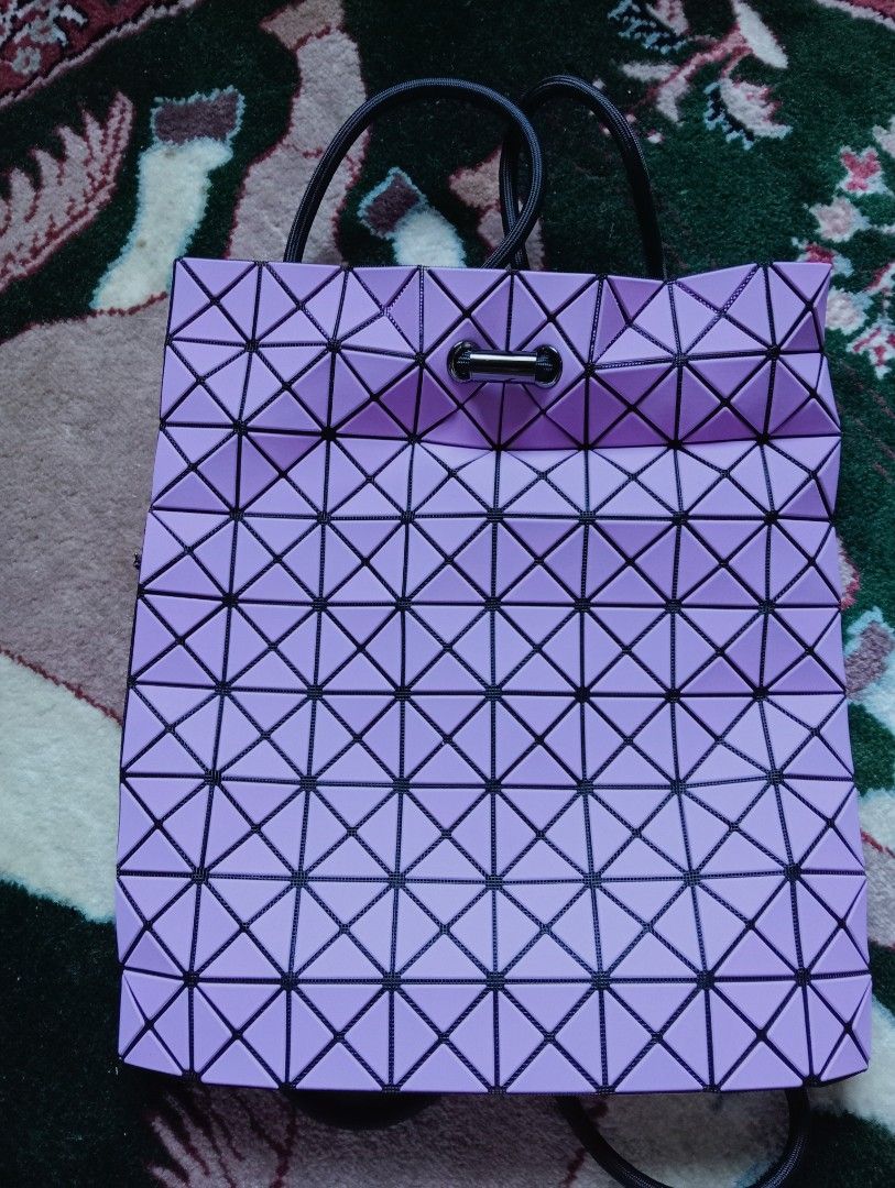 Bao Bao Issey Miyake Geometric Backpack Bag (Category: Luxury Bags & Wallets) located in Baguio. Submitted by cleverlion_e92944 (Listing ID 1416443862, Image 1). Description: - Authentic Bao Bao Issey Miyake backpack bag - Light purple color with black accents - Drawstring closure - Zippered interior pocket - Includes dust bag - Black interior - Zipper pull with Bao Bao logo - Unique geometric design.