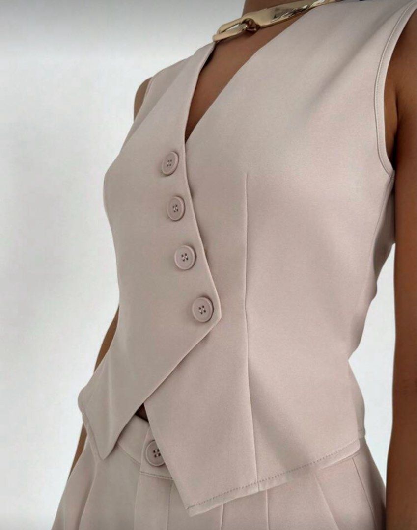 Beige Vest and Shorts Set Coordinates Terno (Category: Sets or Coordinates) located in Manila. Submitted by xuchesca (Listing ID 1416459532, Image 2). Description: - Beige vest and shorts set - Vest: V-neck, button closure - Shorts: High-waisted - Perfect for a chic look - Suitable for casual and semi-formal events - Versatile wardrobe addition fits S-M Payment through Gcash/ Bank Transfer .