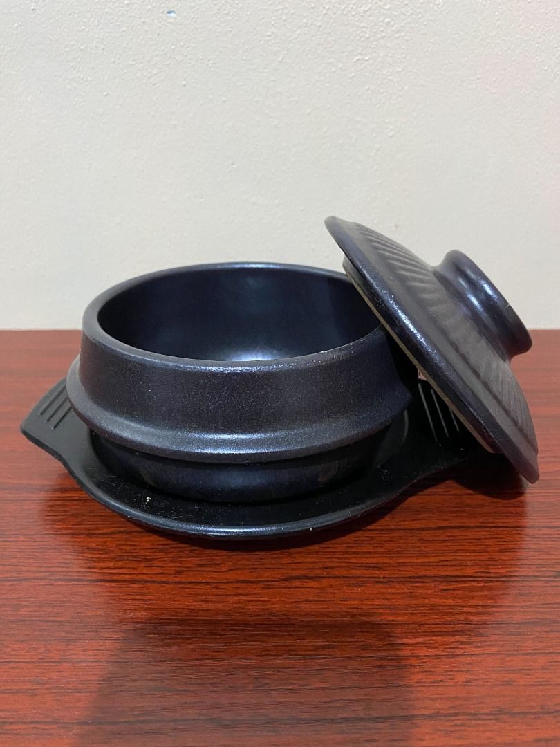 Black Ceramic Clay Hot Pot (Category: Cookware & Accessories) located in Taguig. Submitted by rudelynamo62091 (Listing ID 1416573203, Image 1). Description: Black ceramic casserole dish with lid and stand. Medium size, textured exterior. Perfect for individual servings of stews, soups, or rice. Used once, please message me if you’d like additional photos or images. .