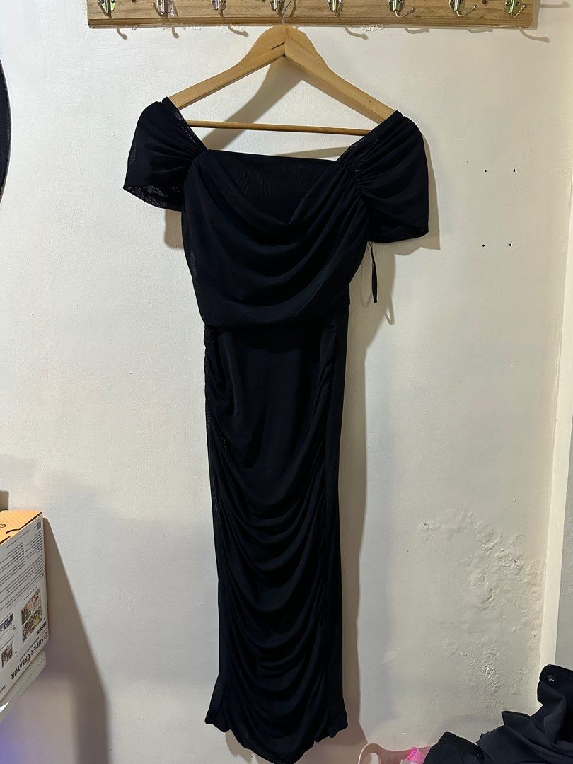 Black Off-Shoulder Midi Dress (Category: Dresses) located in Marikina City. Submitted by abyrivera (Listing ID 1416571933, Image 1). Description: - Black off-shoulder midi dress - Features ruched bodice and skirt - Made of lightweight, flowing fabric - Ideal for a night out or special event.