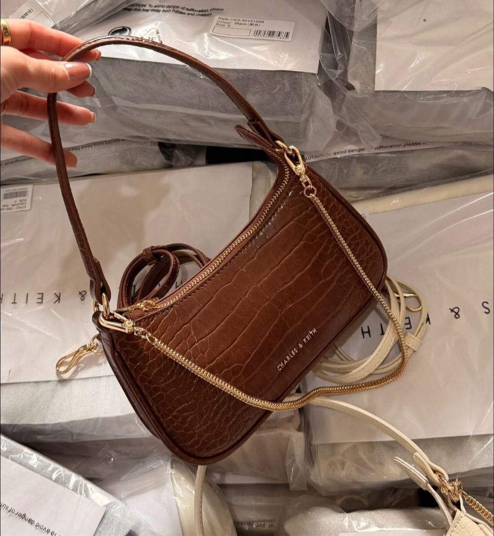 Charles and Keith Aspelth Chain 2-way Bag (Brown) (Category: Cross-body Bags) located in Paranaque City. Submitted by classicbuysph (Listing ID 1416615603, Image 2). Description: Charles and Keith Aspelth Chain 2-way Bag (Brown) - Brand new and sealed - Mall pull out - add 50 for paperbag - Same day delivery via lalamove. J&T deliveries for outside Metro Manila - Location: Pasig.