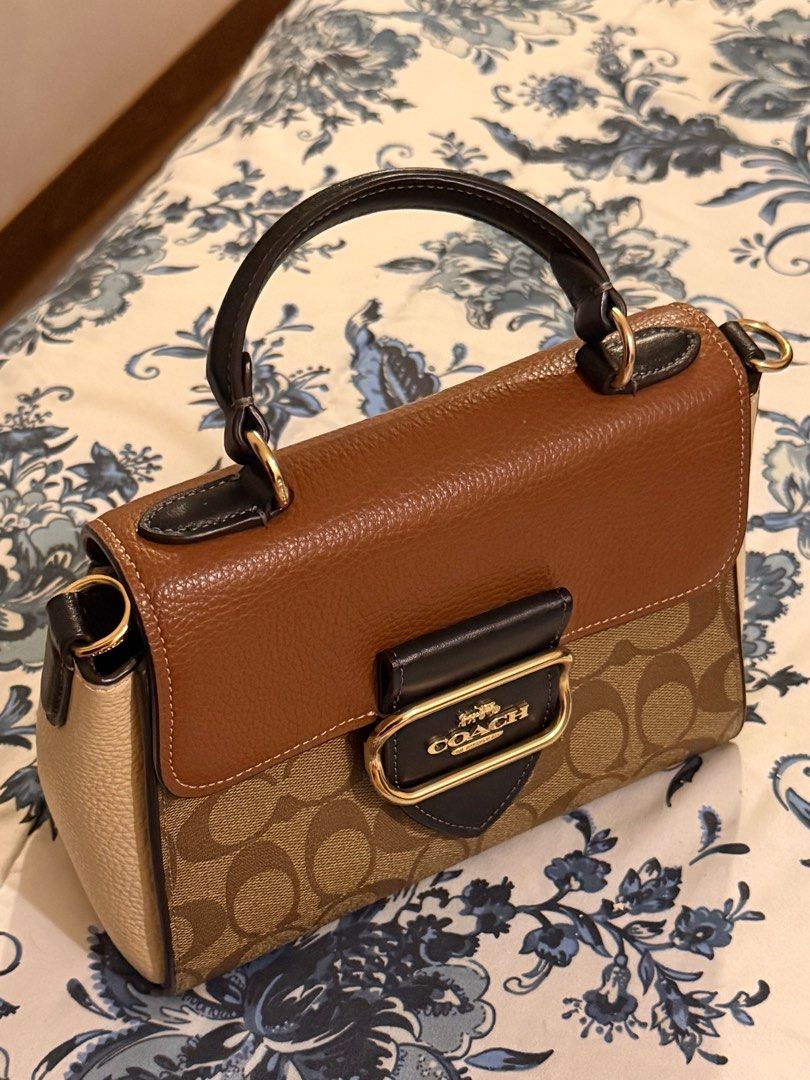 Coach Morgan Top Handle Satchel (Category: Luxury Bags & Wallets) located in Manila. Submitted by rocco_ (Listing ID 1416611555, Image 1). Description: Coach handbag with signature pattern, top handle, and detachable strap. Features brown leather and gold-tone clasp. No issues, worn once or twice only. Dimensions: Length: 4.25" Height: 8.25" Width: 6.25".
