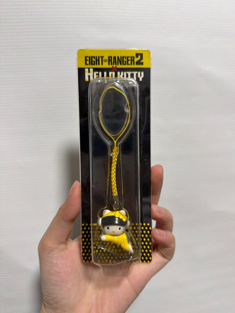 Eight Ranger 2 Hello Kitty Keychain (Category: Character Goods) located in Cainta. Submitted by preloveddeclutterr (Listing ID 1416532164, Image 1). Description: HK COLLECTIBLE FROM JAPAN *Sold for ₱450+/¥1000+ online 7-ELEVEN convenience stores x Eight Ranger 2 Hello Kitty charm keychain released in 2014 - Eight Ranger 2 Kitty keychain - Features Hello Kitty in a yellow outfit and black cap - Brand new, in original packaging - Comes with a yello