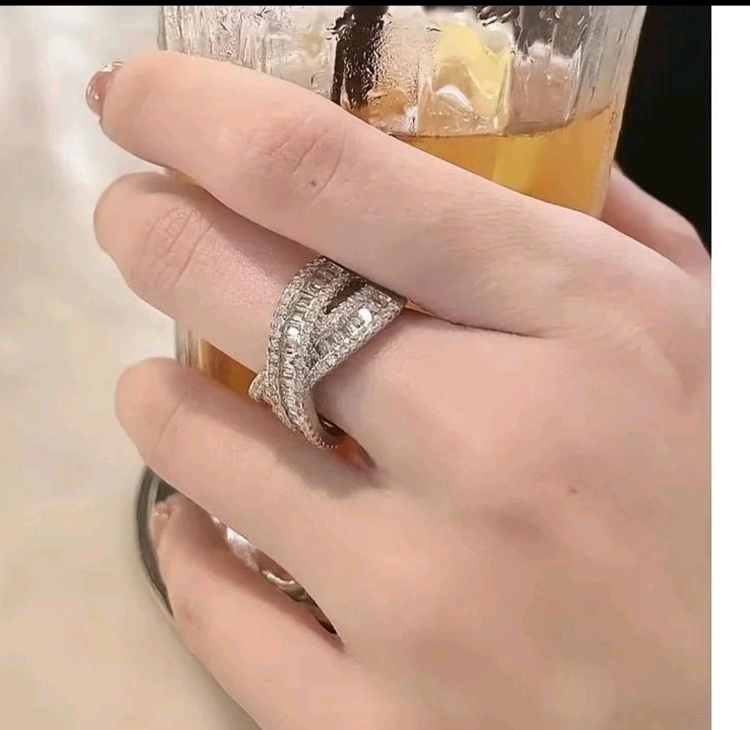 Elegany Moisanite Ring (Category: Rings) located in Antipolo. Submitted by uncovidspace (Listing ID 1416610946, Image 2). Description: Elegant silver ring featuring a unique criss-cross design. Adorned with sparkling cubic zirconia stones. A stylish accessory suitable for various occasions..