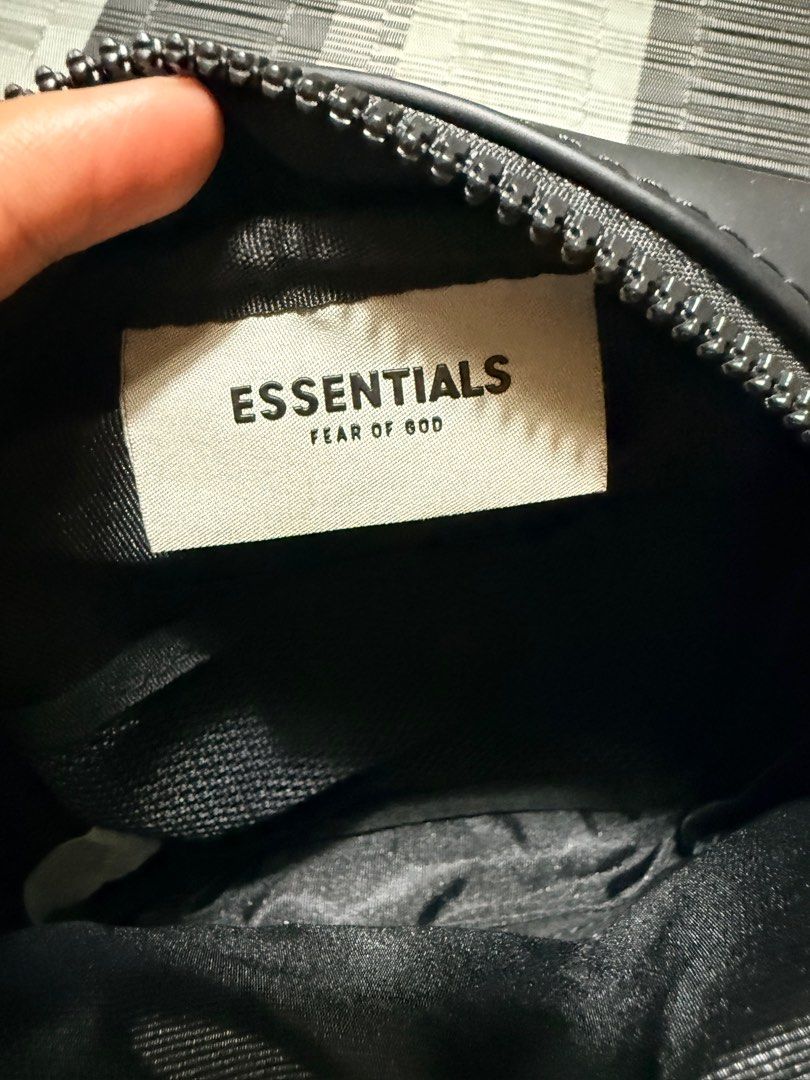 Essentials Fear of God Crossbody Bag (Category: Cross-body Bags) located in Binan City. Submitted by jgca01 (Listing ID 1416551216, Image 2). Description: Essentials Fear of God crossbody bag in black. w/ small chip on 2 corners as seen on pic.