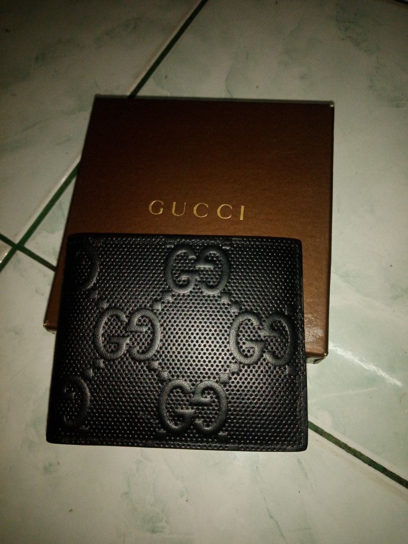 Gucci Black Leather Wallet (Category: Luxury Bags & Wallets) located in Marikina City. Submitted by rjhay251210 (Listing ID 1416564709, Image 1). Description: - Authentic Gucci wallet - Black leather exterior - Embossed Gucci logo - Multiple card slots - Bill compartment - Black leather interior with Gucci logo - Comes with original Gucci box.